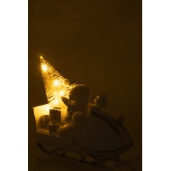 Papá Noel en trineo de resina blanco 31x11x30 cm.