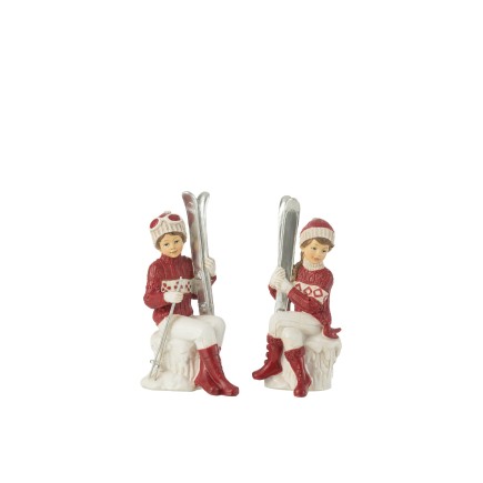 Lot fille et garçon assis avec ski en poly blanc 10x7x17cm